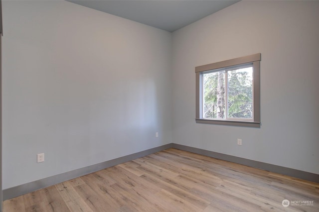 unfurnished room with light hardwood / wood-style flooring