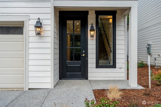 view of exterior entry featuring a garage