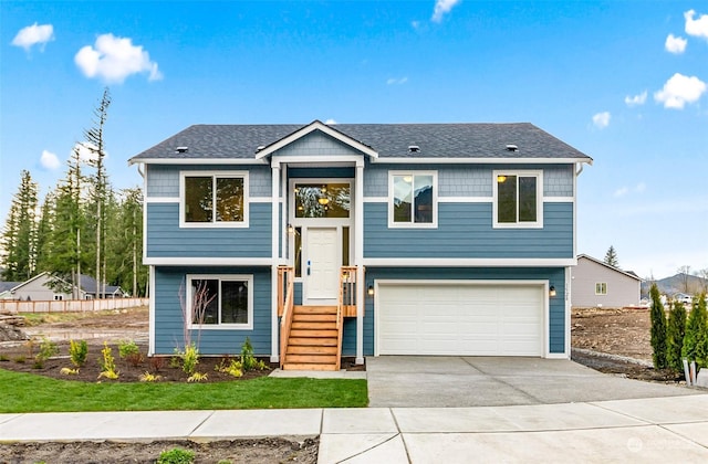 bi-level home featuring a garage