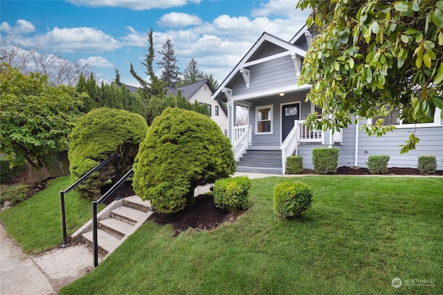 view of front facade with covered porch and a front lawn