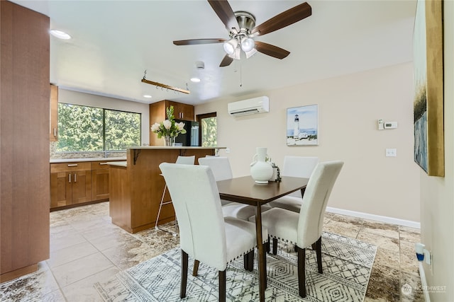 dining area with ceiling fan, light tile patterned floors, and a wall mounted AC