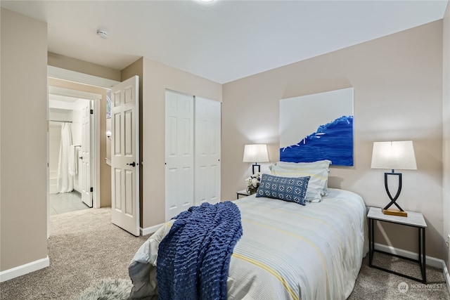 bedroom featuring light carpet and a closet