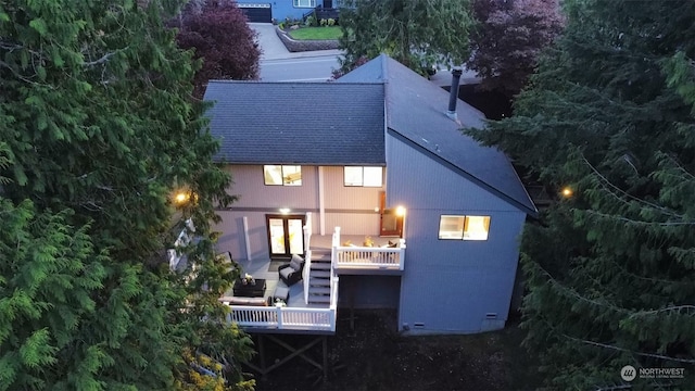 rear view of property with a balcony