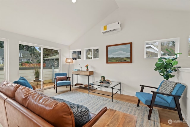 interior space featuring lofted ceiling, an AC wall unit, and a wealth of natural light