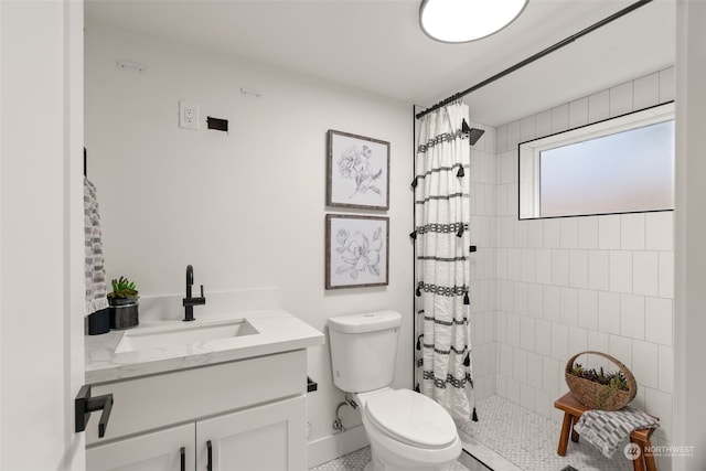 bathroom with vanity, toilet, and walk in shower