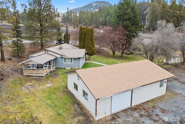 birds eye view of property featuring a mountain view