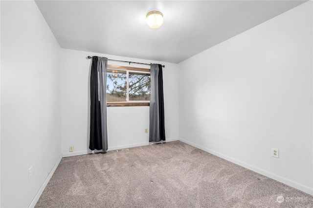 view of carpeted spare room