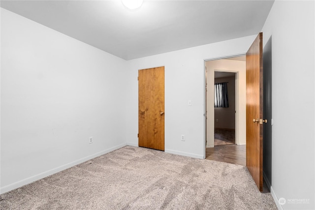 unfurnished bedroom with light carpet