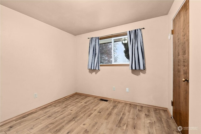 unfurnished room featuring light hardwood / wood-style floors