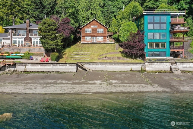 birds eye view of property featuring a water view