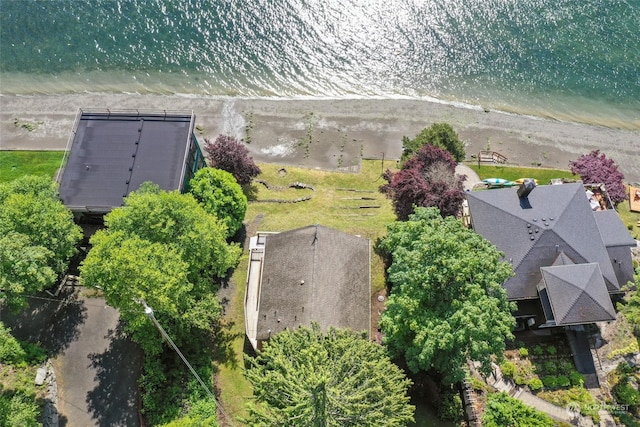 bird's eye view with a water view and a beach view