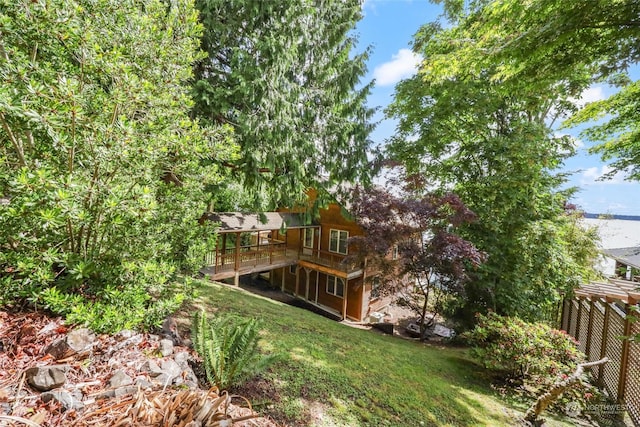 view of yard featuring a wooden deck