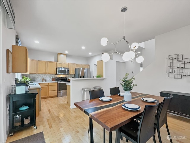 dining space featuring light hardwood / wood-style flooring