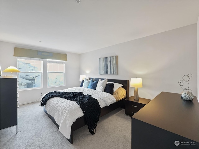 bedroom with light colored carpet