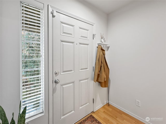 doorway with light wood-type flooring