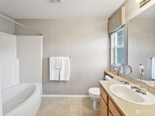 full bathroom featuring toilet, shower / washtub combination, and vanity