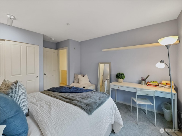 bedroom with light colored carpet