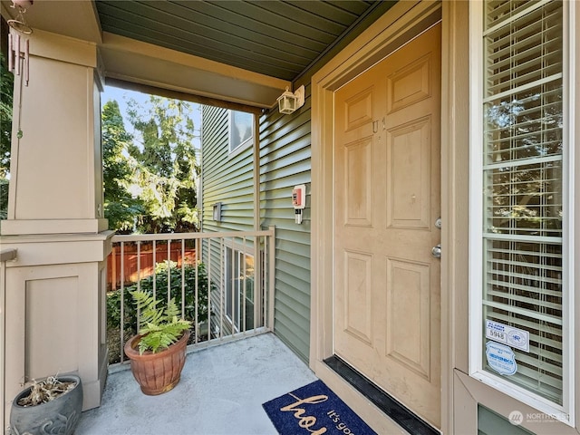 property entrance with covered porch