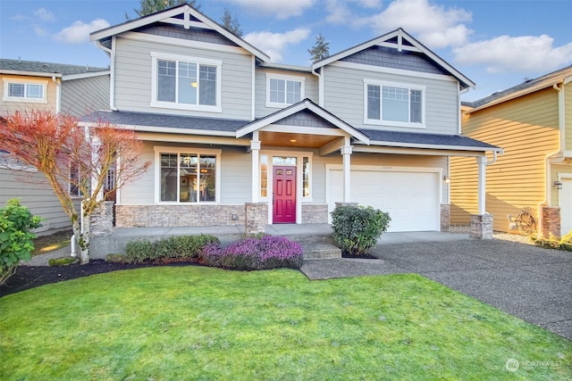 craftsman-style house featuring a garage and a front lawn