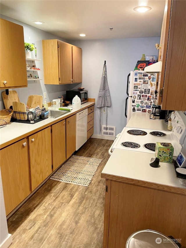 4105 Stone Way N, Seattle, WA 98103 - kitchen with light wood-type flooring and white appliances