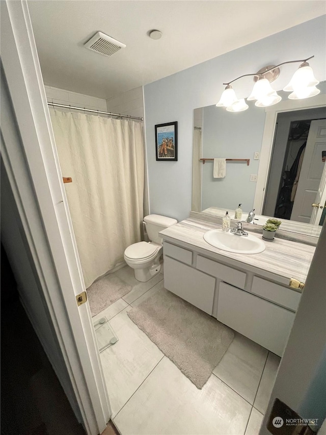 4105 Stone Way N, Seattle, WA 98103 - bathroom with tile patterned floors, vanity, and toilet