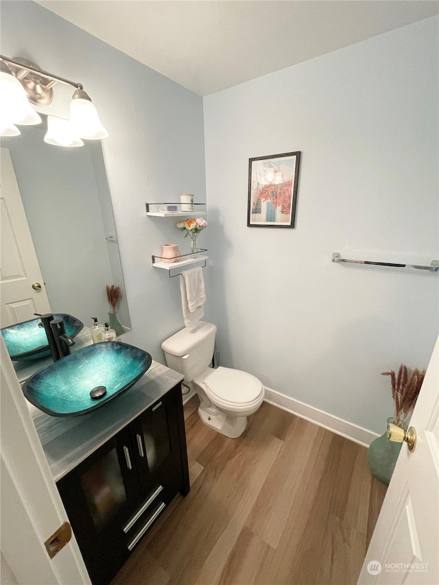 4105 Stone Way N, Seattle, WA 98103 - bathroom featuring vanity, hardwood / wood-style flooring, and toilet