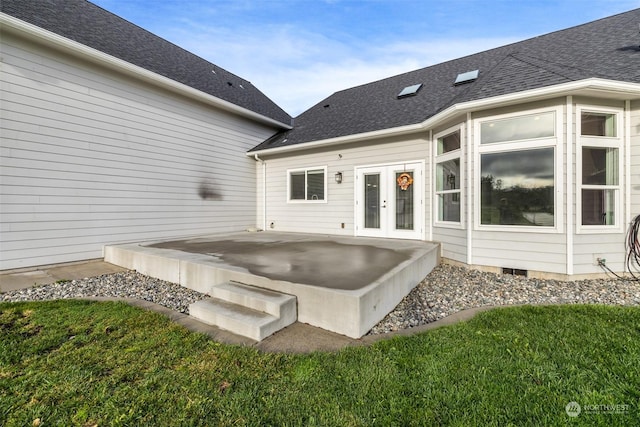 rear view of house featuring french doors and a patio