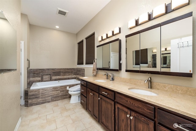 full bathroom with tile patterned flooring, shower with separate bathtub, vanity, and toilet