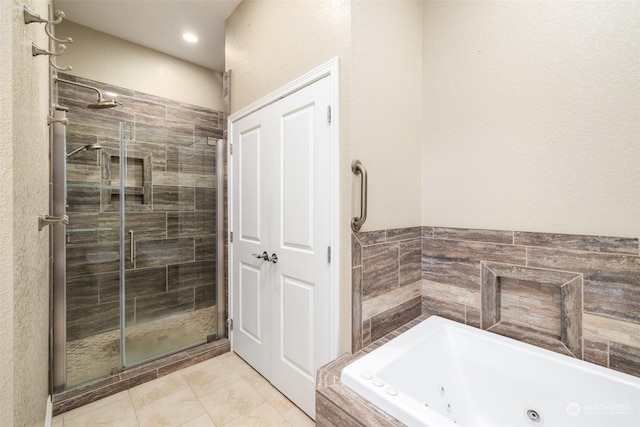 bathroom featuring separate shower and tub and tile patterned flooring