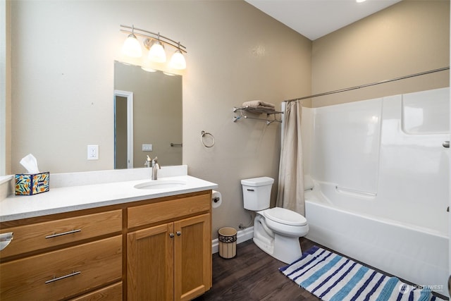 full bathroom featuring shower / tub combo, vanity, hardwood / wood-style flooring, and toilet