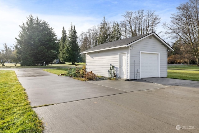 garage featuring a yard