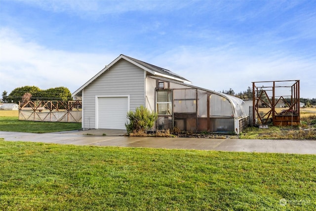 view of property exterior featuring an outdoor structure and a lawn