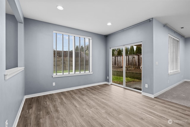 spare room with light wood-type flooring