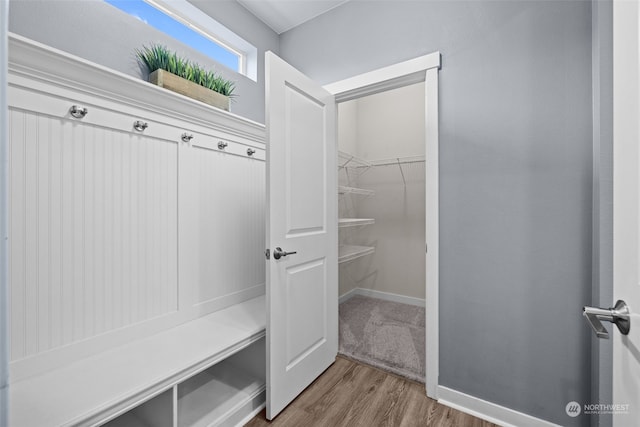 mudroom with wood-type flooring