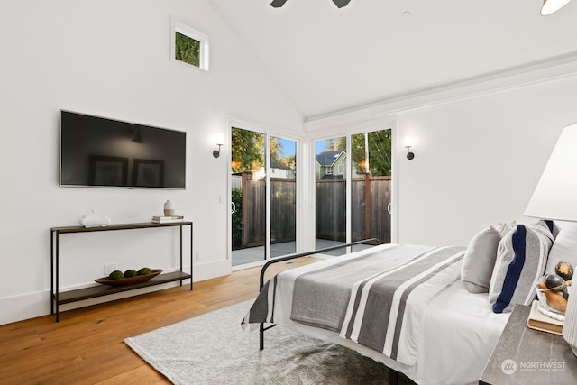 bedroom featuring wood-type flooring, high vaulted ceiling, ceiling fan, and access to outside