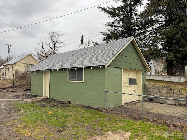 view of outbuilding with a yard