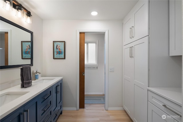 bathroom featuring vanity and hardwood / wood-style floors