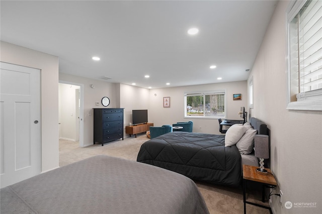 bedroom featuring light carpet