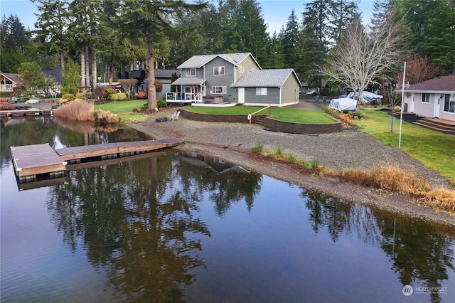 exterior space with a yard and a water view