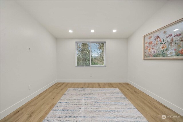 spare room with light wood-type flooring