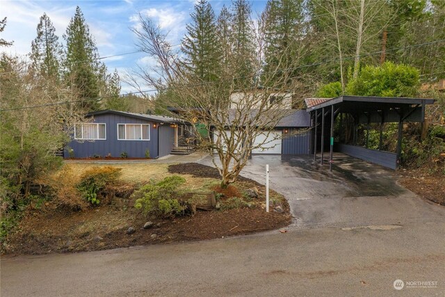 view of front facade with a garage and a carport