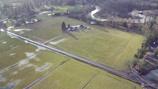 birds eye view of property with a rural view