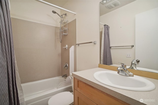 full bathroom featuring shower / bath combo, vanity, and toilet