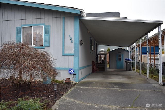 view of front of home featuring a storage shed