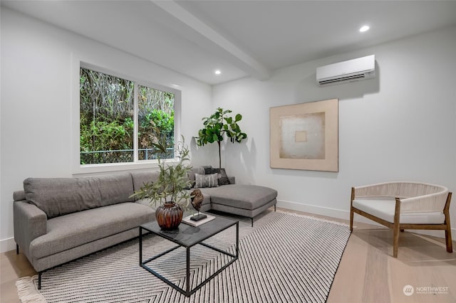 living room featuring beam ceiling, light wood-type flooring, and an AC wall unit