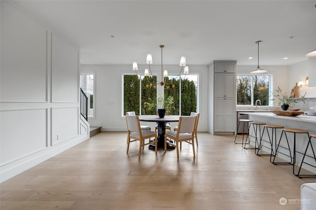 dining space featuring light wood-type flooring