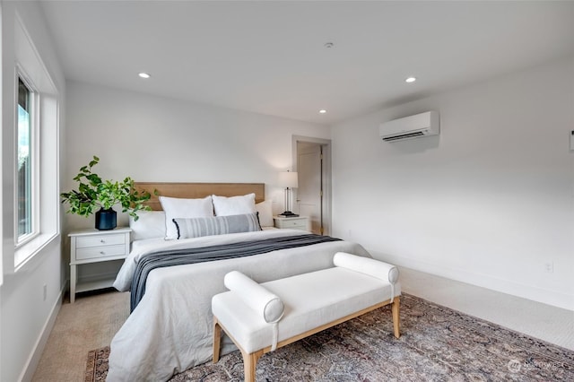 carpeted bedroom featuring a wall unit AC