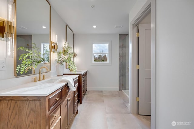 bathroom featuring vanity and a shower with shower door