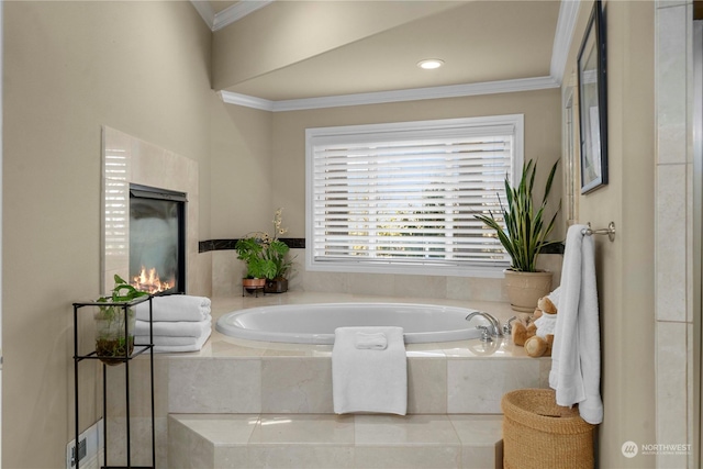 bathroom featuring ornamental molding and a relaxing tiled tub