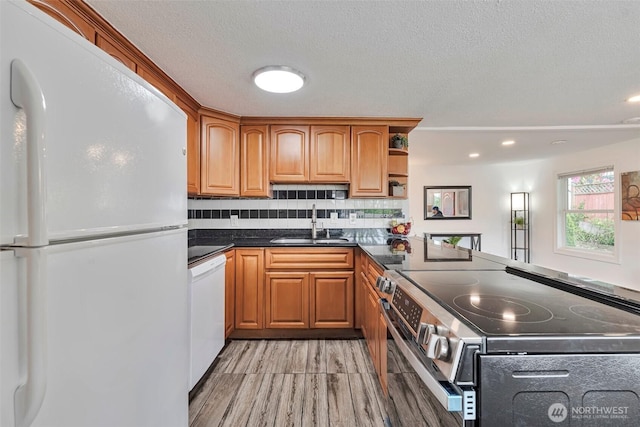 11427 Military Rd, Seattle, WA 98168 - kitchen featuring white appliances, a sink, light wood-type flooring, dark countertops, and open shelves